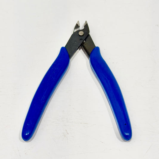 Reverse view of blue-handled mini flush cutters