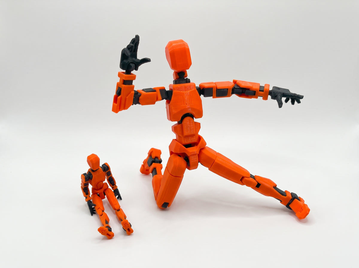 Orange crash test dummy figures showing articulated action and seated poses