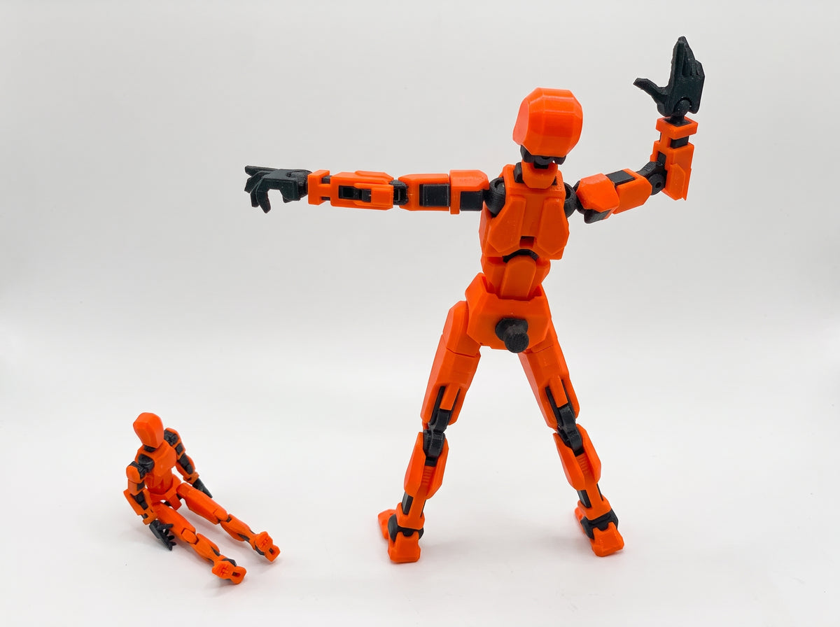 Orange crash test dummy figures in two sizes standing side by side