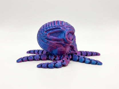 Side view of the articulated octo-alien showing its ridged alien head and jointed blue and purple tentacles.