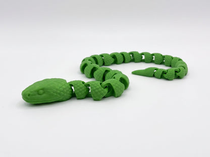 Green articulated snake with a segmented body coiled on a white background