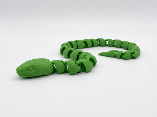 Green articulated snake with a segmented body coiled on a white background